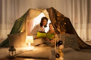 family reading book in modular home sanctuary